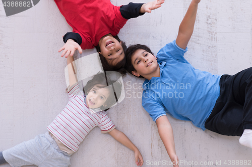 Image of young boys having fun on the floor