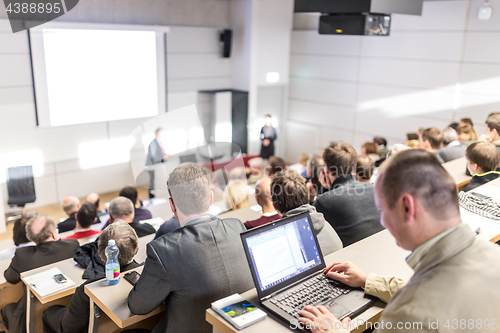 Image of Business speaker giving a talk at business conference event.