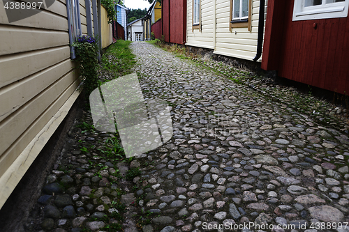 Image of cobblestone pavement and wooden old houses in Porvoo, Finland