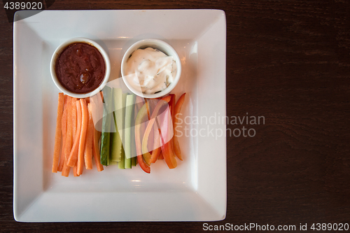 Image of Fresh carrot cucumber pepper and two sauce