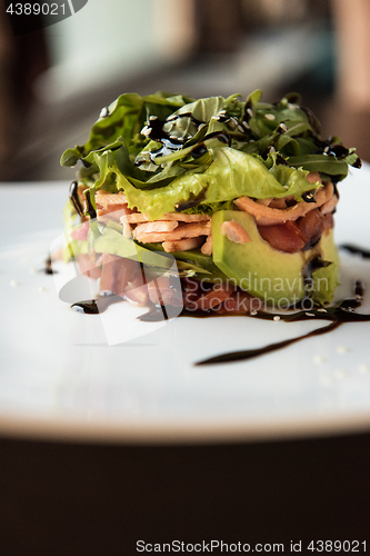 Image of Salad from avocado lettuce tomato and salmon fish