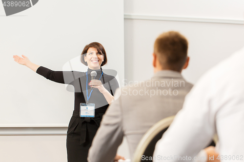 Image of group of people at business conference or lecture