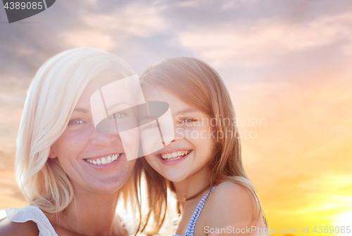 Image of happy mother and daughter portrait over summer sky