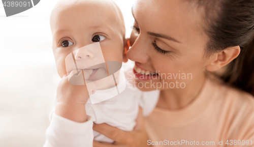 Image of happy mother with little baby boy at home