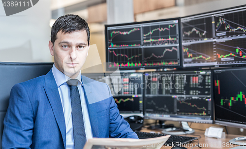 Image of Business portrait of stock broker in traiding office.