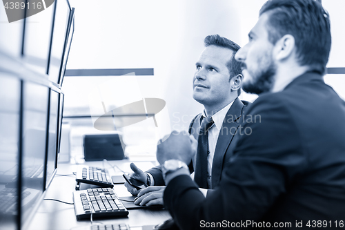 Image of Successful businessmen in trading office. Business success.
