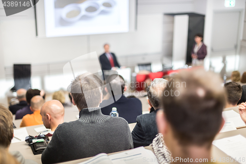 Image of Business speaker giving a talk at business conference event.