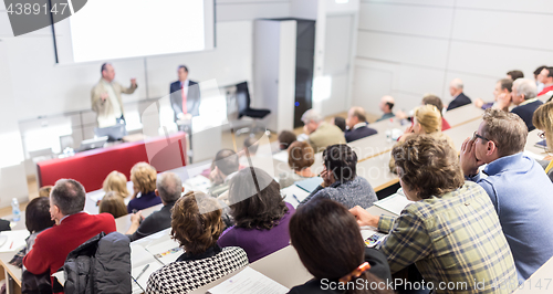 Image of Business speaker giving a talk at business conference event.