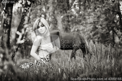 Image of Sepia Portrait Of A Blonde Woman In The Forest