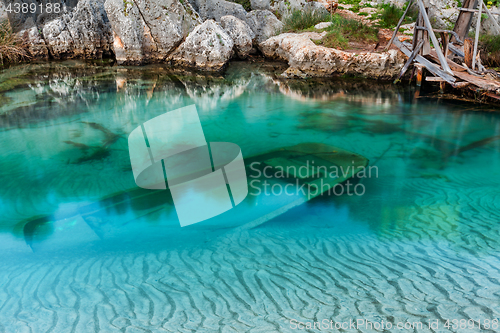 Image of sunken wooden boat