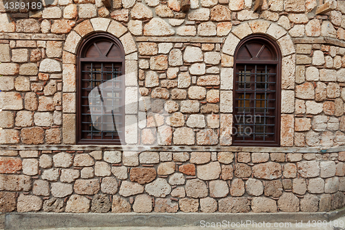 Image of Two windows on old stone wall