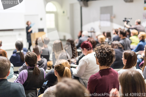 Image of Woman giving presentation on business conference.