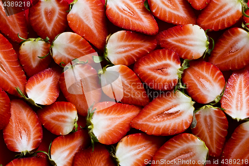 Image of Fresh strawberries sliced into halves