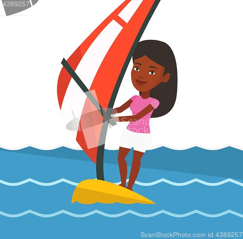 Image of Young woman windsurfing in the sea.