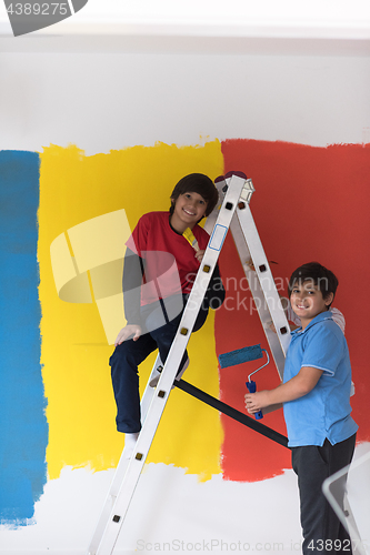 Image of boys painting wall