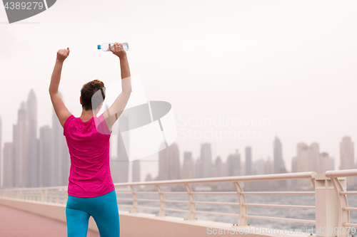 Image of young woman celebrating a successful training run