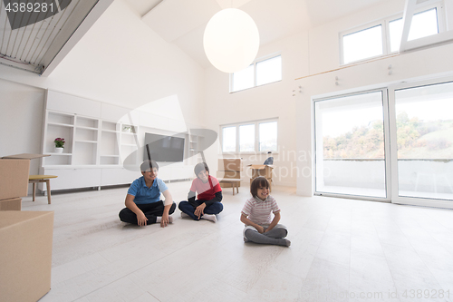 Image of young boys having fun on the floor