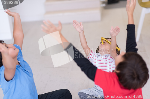 Image of young boys having fun on the floor