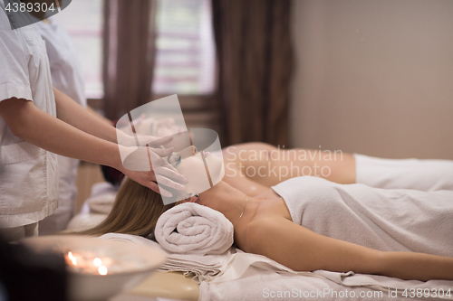 Image of couple enjoying head massage at the spa