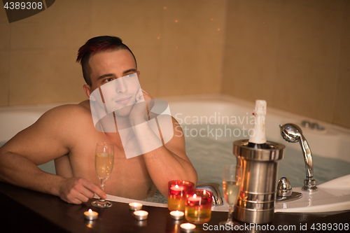 Image of man relaxing in the jacuzzi