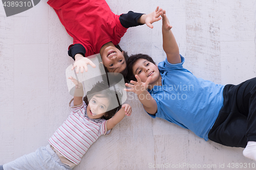 Image of young boys having fun on the floor