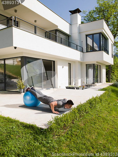 Image of man doing morning yoga exercises
