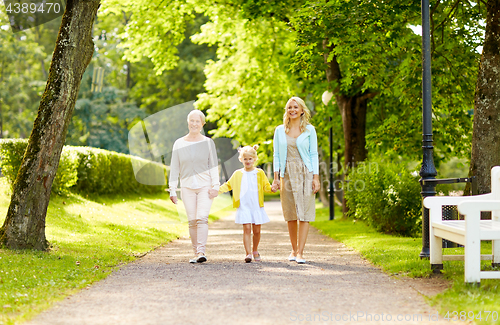 Image of happy mother, daughter and grandmother at park