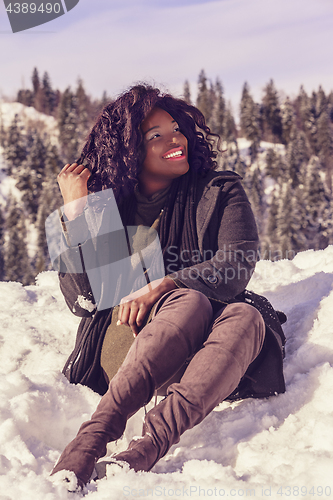 Image of Happy African woman in winter