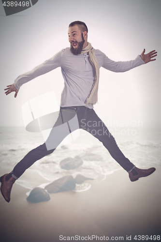 Image of A man makes an air jump