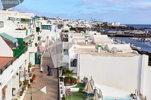 Image of cottages of Puerto del Carmen town on the coast of Atlantic Ocea