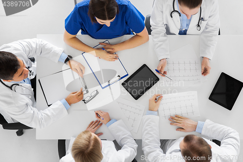 Image of group of doctors with cardiograms at hospital