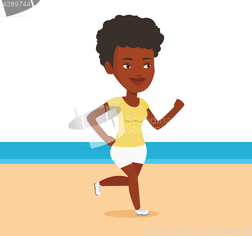 Image of Young sporty woman jogging on the beach.