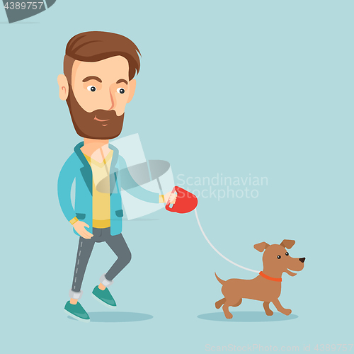 Image of Young man walking with his dog.