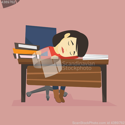 Image of Student sleeping at the desk with book.