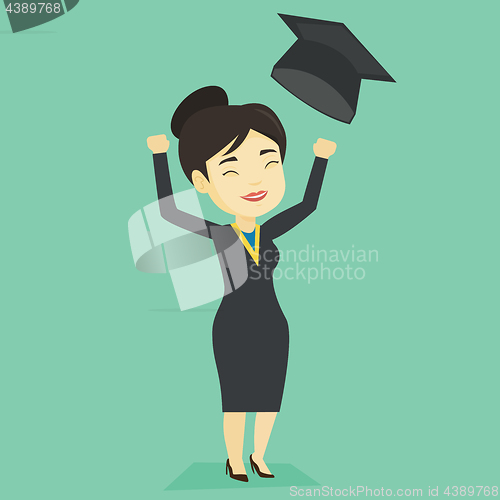 Image of Graduate throwing up graduation hat.