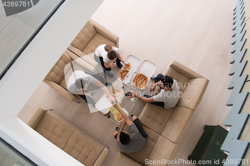 Image of Pizza time a group of people
