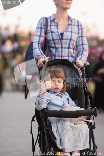 Image of mother and daughter in flower garden