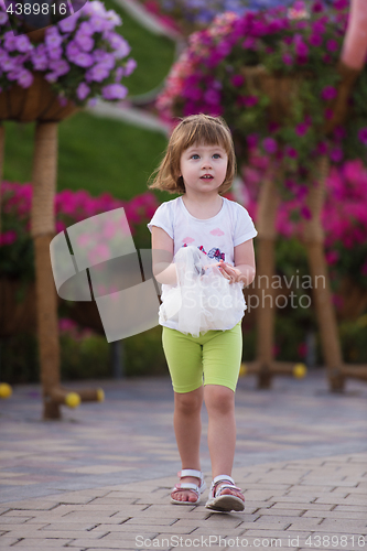 Image of little girl with a doll