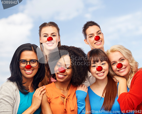 Image of international group of happy women at red nose day
