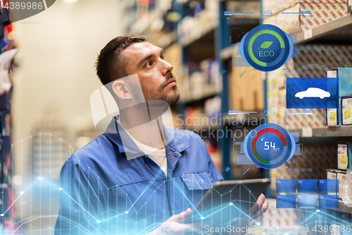 Image of auto mechanic or smith with tablet pc at workshop