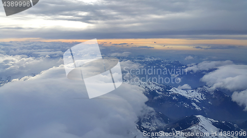 Image of Top view on the Alps, covered with snow and clouds