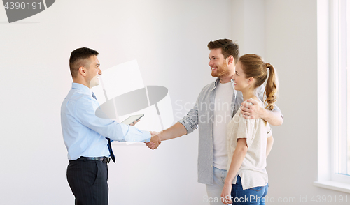 Image of man and realtor shaking hands at new home