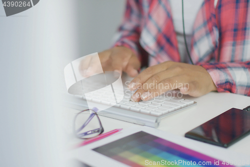 Image of Crop worker using keyboard