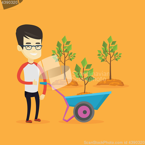 Image of Man pushing wheelbarrow with plant.