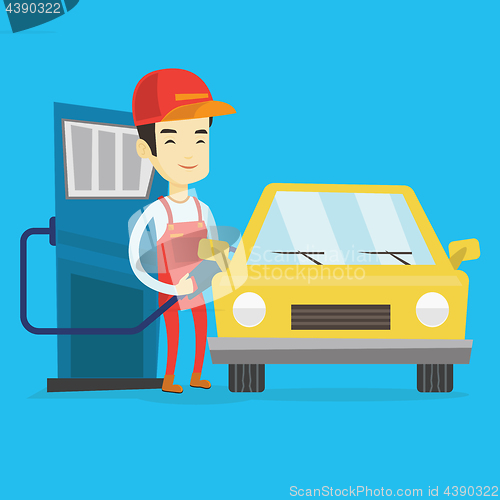 Image of Worker filling up fuel into car at the gas station