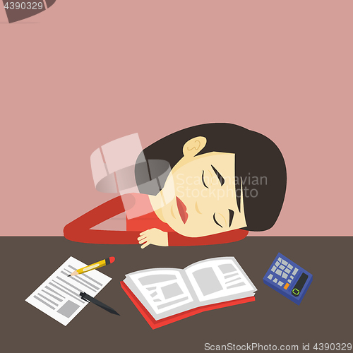 Image of Student sleeping at the desk with book.