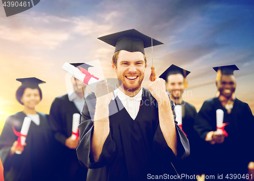 Image of happy student with diploma celebrating graduation