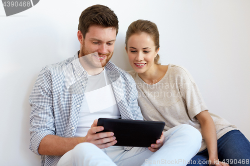 Image of happy couple with tablet pc computer