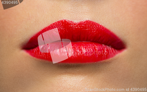 Image of lips or mouth of woman with red lipstick