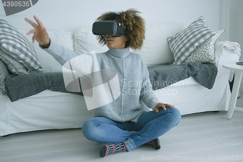 Image of Woman enjoying VR glasses